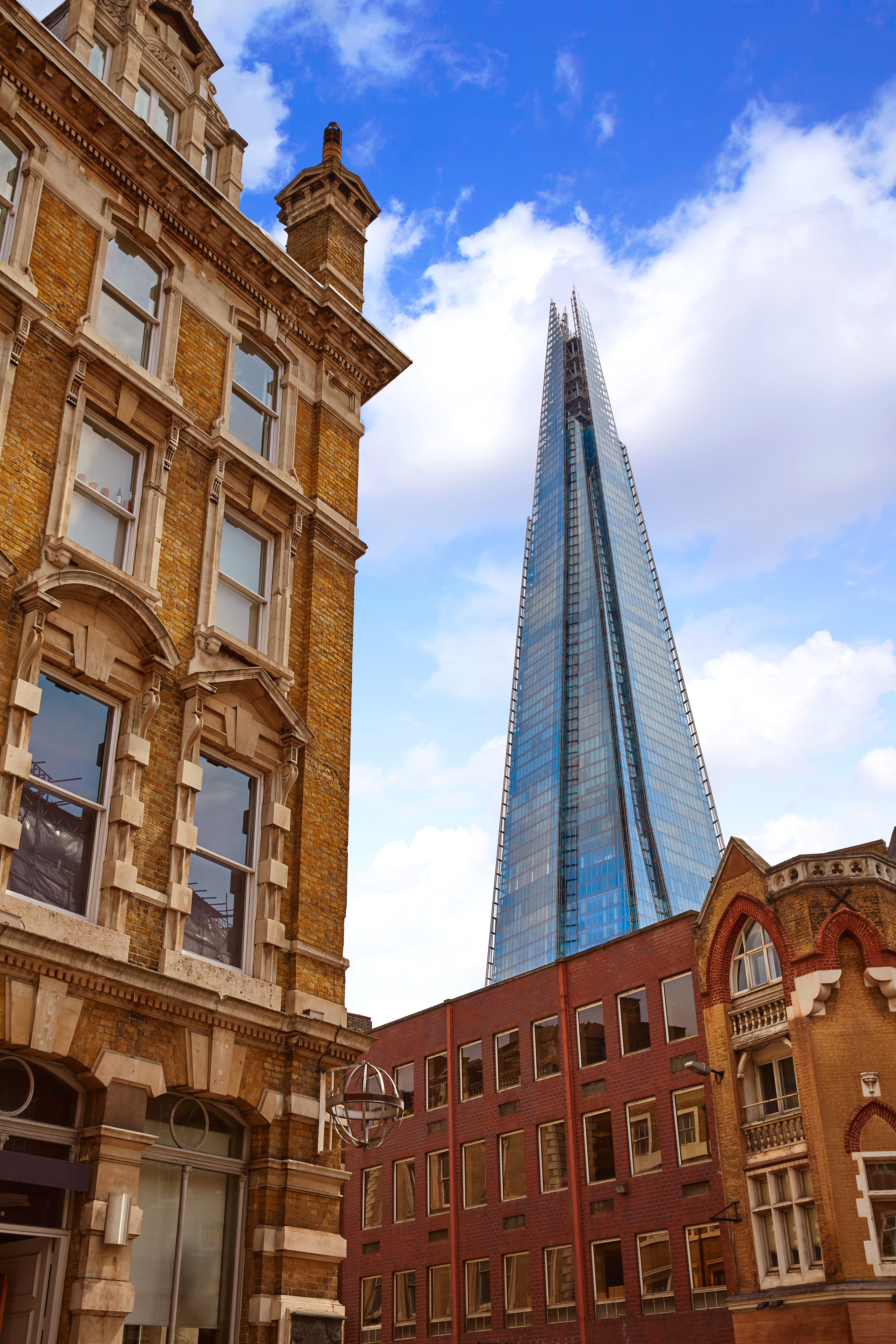 The Shard above old London brick buildings